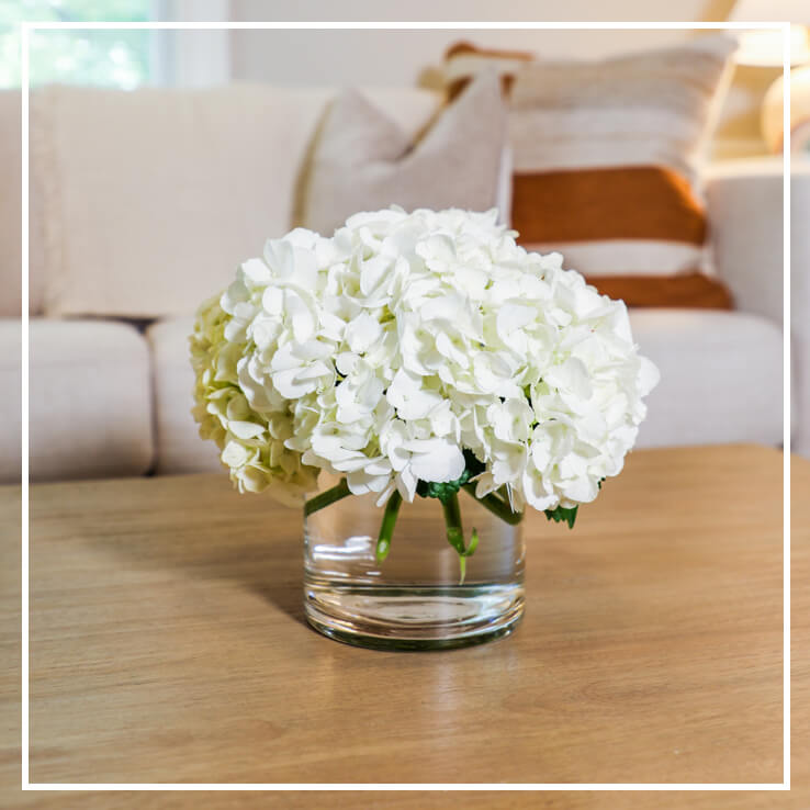 White flowers on table | Roots to Stillness