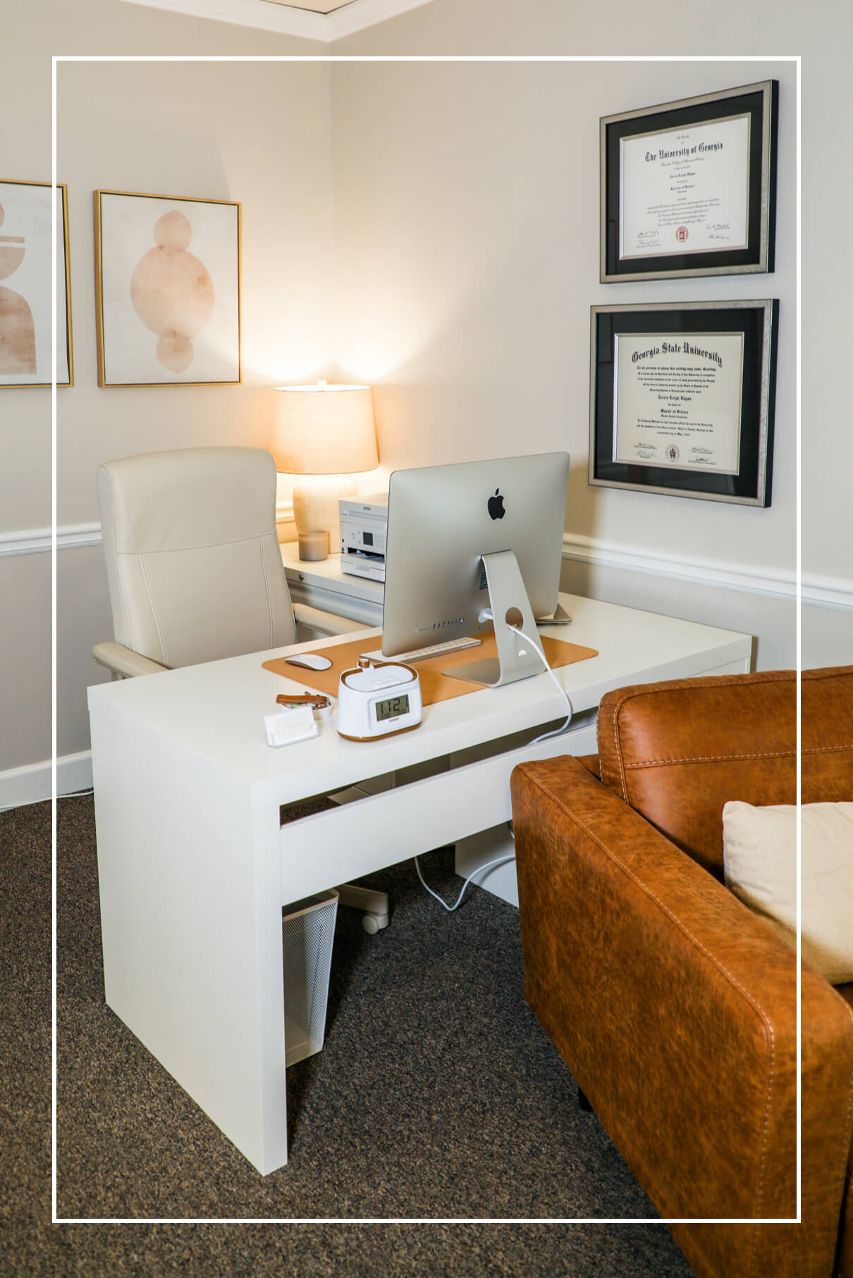 Office space with degrees on the wall | Roots to Stillness